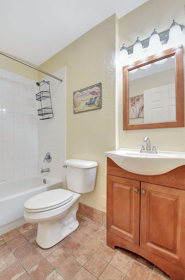 full bathroom featuring baseboards, toilet, tile patterned flooring, vanity, and shower / bathing tub combination