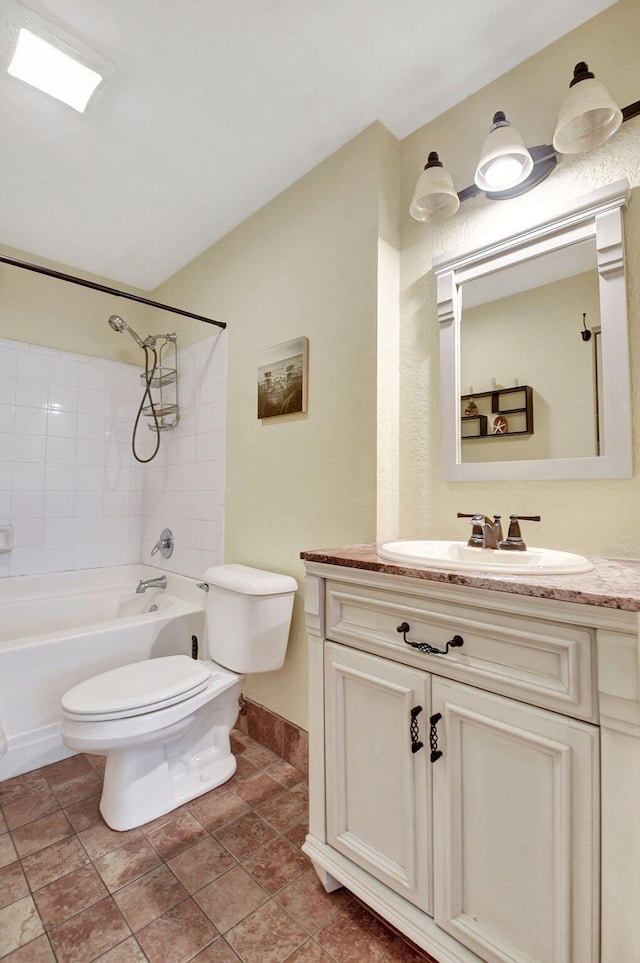 full bathroom featuring lofted ceiling, bathing tub / shower combination, vanity, and toilet