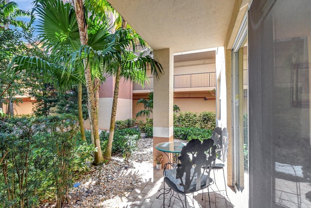 exterior space with a patio area and stucco siding