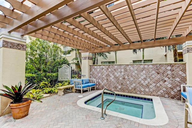 view of swimming pool featuring a community hot tub, a patio, fence, and a pergola