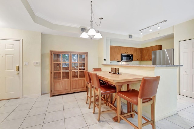 dining space featuring a chandelier, ornamental molding, light tile patterned flooring, and visible vents