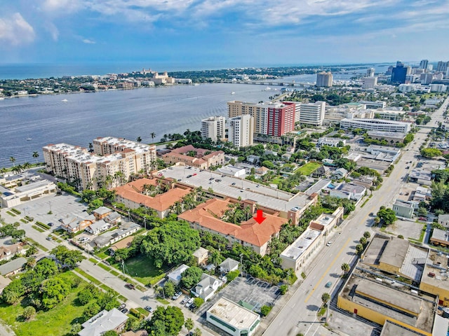 birds eye view of property featuring a view of city and a water view