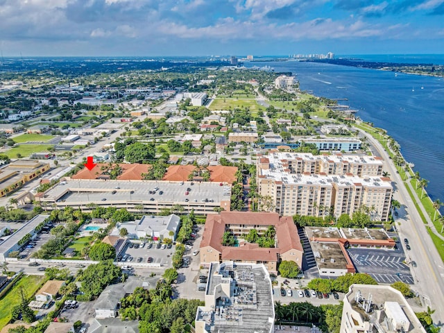 drone / aerial view featuring a water view and a city view