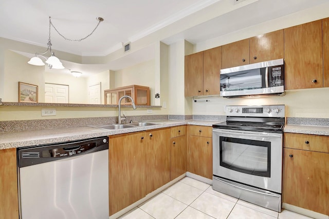 kitchen featuring light tile patterned floors, light countertops, visible vents, appliances with stainless steel finishes, and a sink