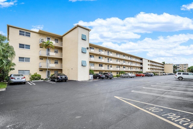 view of property with uncovered parking