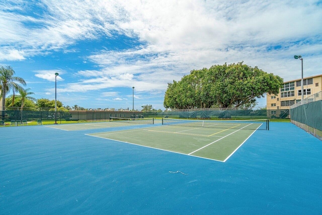 view of sport court with fence