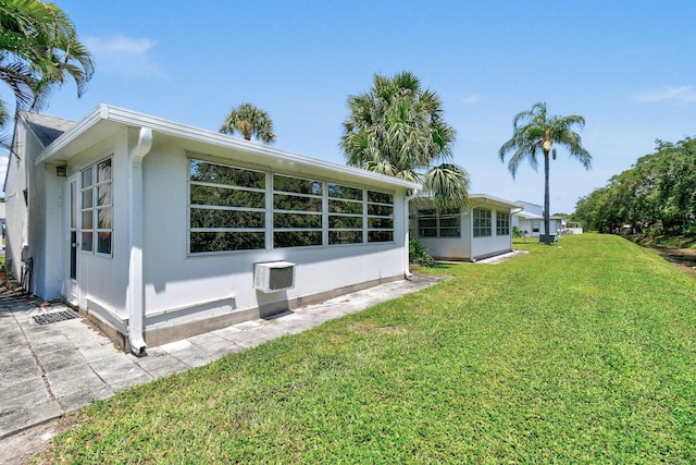 view of property exterior with a lawn