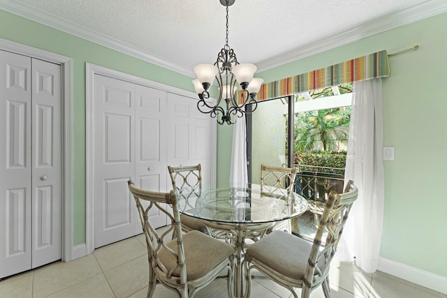 dining area with ornamental molding, a textured ceiling, an inviting chandelier, light tile patterned flooring, and baseboards