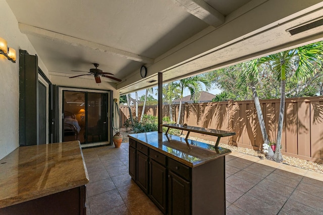 view of patio with a fenced backyard and ceiling fan