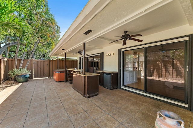 view of patio / terrace featuring a gate, a ceiling fan, and fence