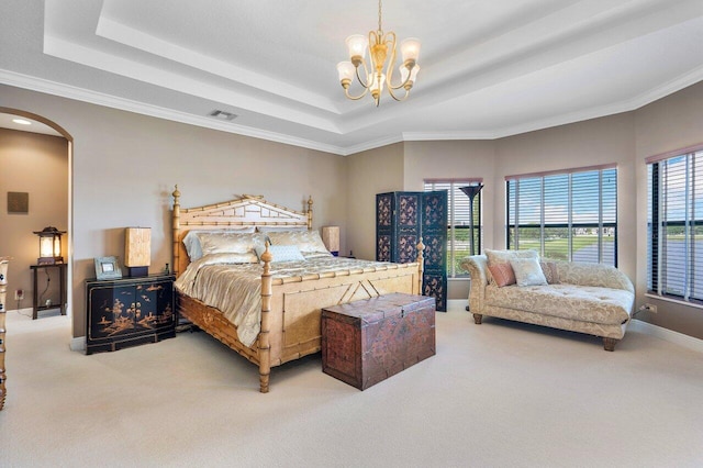 bedroom with arched walkways, carpet floors, visible vents, a raised ceiling, and an inviting chandelier