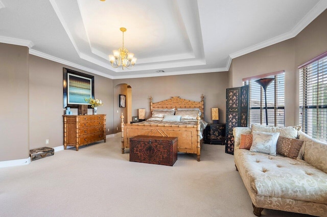 bedroom with light carpet, arched walkways, a raised ceiling, and a chandelier