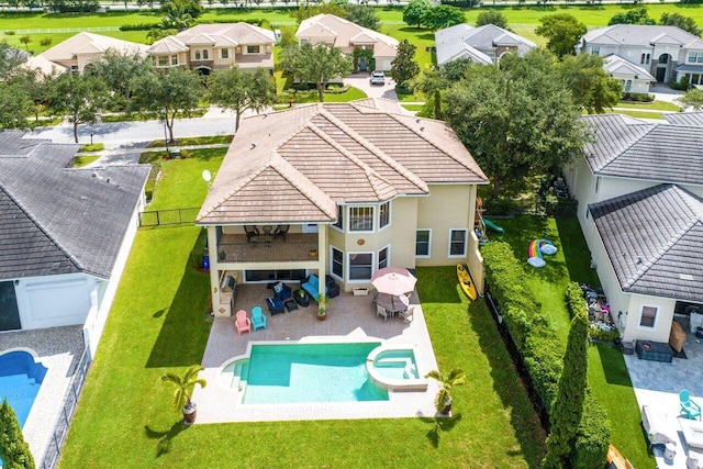 birds eye view of property with a residential view