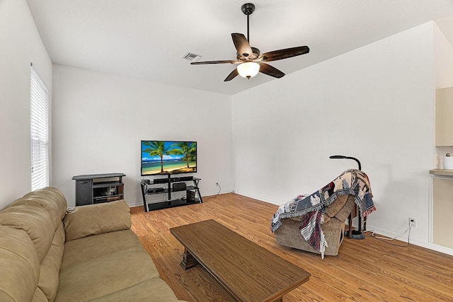 10617 Pine Cone Ln, Fort Pierce, FL 34945 - living room with ceiling fan, light wood-type flooring, visible vents, and baseboards