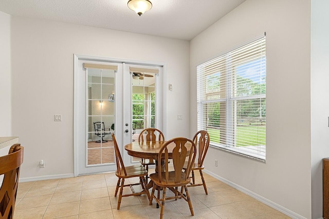 10617 Pine Cone Ln, Fort Pierce, FL 34945 - dining area featuring french doors, light tile patterned flooring, and baseboards