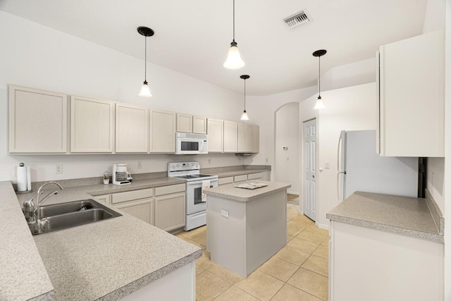 10617 Pine Cone Ln, Fort Pierce, FL 34945 - kitchen featuring decorative light fixtures, light countertops, visible vents, a sink, and white appliances