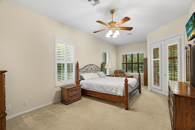 10617 Pine Cone Ln, Fort Pierce, FL 34945 - bedroom featuring access to exterior, light carpet, visible vents, and a ceiling fan
