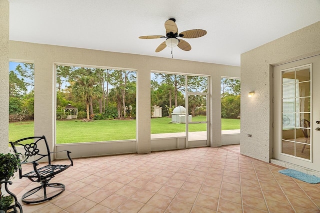10617 Pine Cone Ln, Fort Pierce, FL 34945 - unfurnished sunroom featuring a healthy amount of sunlight and ceiling fan