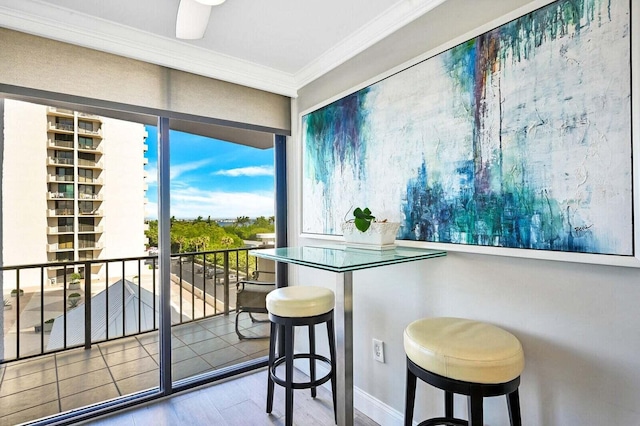 interior space featuring ornamental molding and wood finished floors