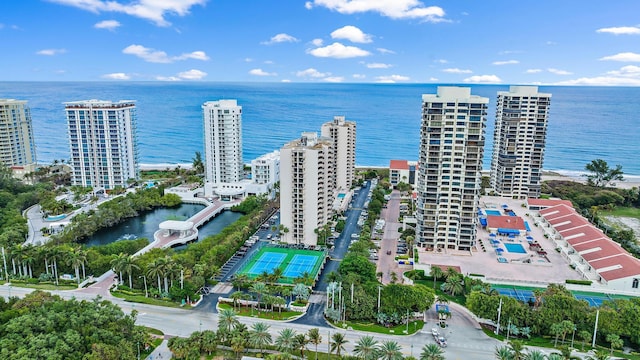 birds eye view of property featuring a view of city and a water view