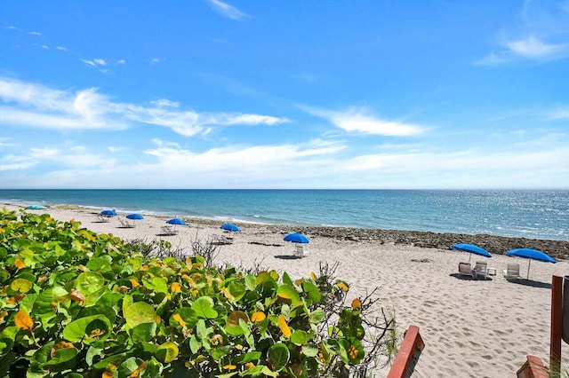 property view of water featuring a beach view