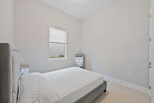 bedroom featuring baseboards