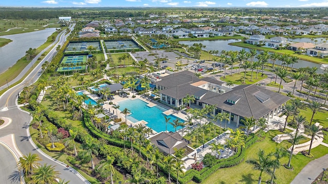 birds eye view of property with a water view and a residential view