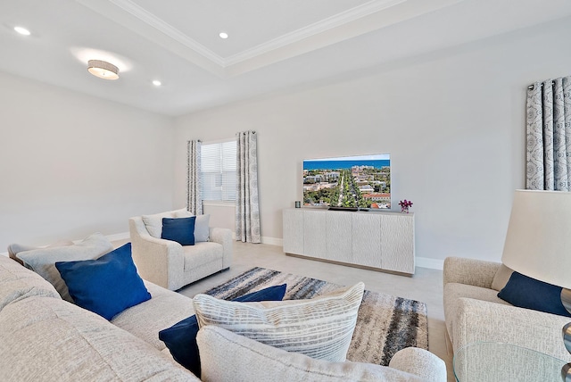 living area with baseboards, ornamental molding, a tray ceiling, and recessed lighting