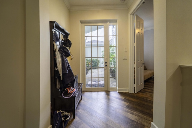 entryway featuring dark wood-style flooring, crown molding, and baseboards