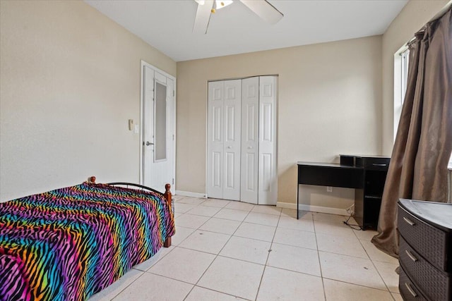 314 SW Cherry Hill Rd, Port Saint Lucie, FL 34953 - bedroom with a closet, light tile patterned flooring, a ceiling fan, and baseboards