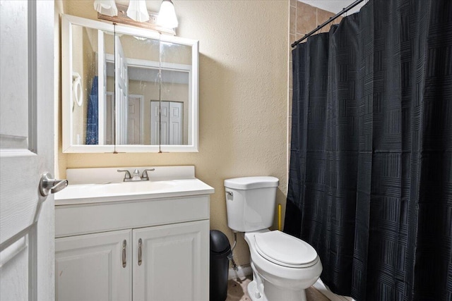 314 SW Cherry Hill Rd, Port Saint Lucie, FL 34953 - full bathroom with a textured wall, a shower with shower curtain, vanity, and toilet