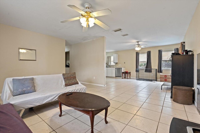 314 SW Cherry Hill Rd, Port Saint Lucie, FL 34953 - living room with baseboards, visible vents, a ceiling fan, and light tile patterned flooring
