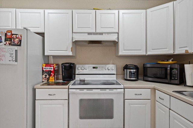314 SW Cherry Hill Rd, Port Saint Lucie, FL 34953 - kitchen with white cabinets, under cabinet range hood, white appliances, and light countertops