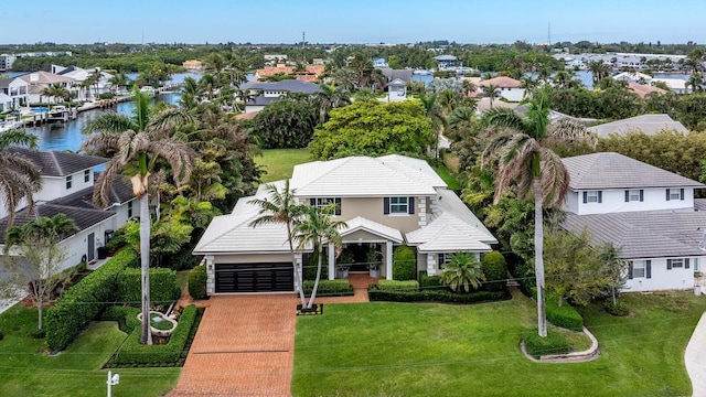 bird's eye view with a water view and a residential view