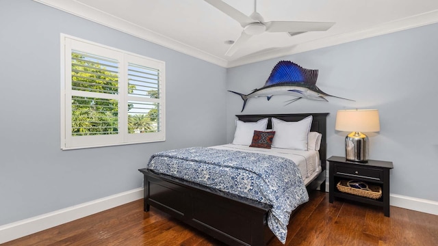 bedroom with ceiling fan, crown molding, baseboards, and wood finished floors