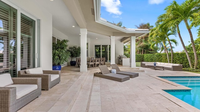 view of patio featuring outdoor dining area, an outdoor living space, and a fenced in pool