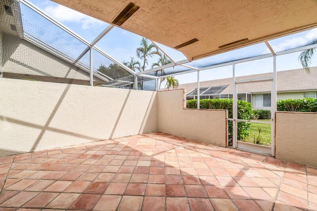 view of patio / terrace featuring a lanai