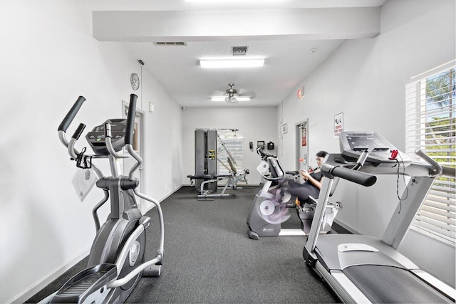 gym with baseboards and visible vents