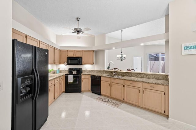 kitchen with a textured ceiling, black appliances, light brown cabinets, a sink, and ceiling fan with notable chandelier