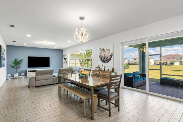 dining room featuring recessed lighting, visible vents, light wood-style floors, a chandelier, and baseboards