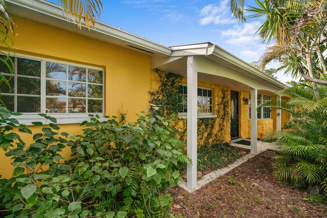 view of side of home featuring stucco siding