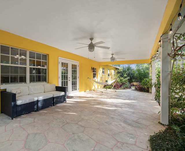 view of patio / terrace featuring an outdoor hangout area, a ceiling fan, and french doors