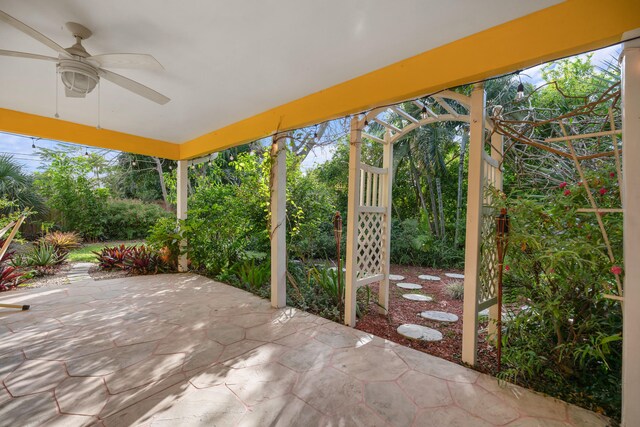 view of patio / terrace with french doors, fence, and ceiling fan