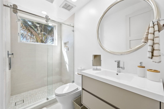 full bath featuring visible vents, toilet, a stall shower, and vanity