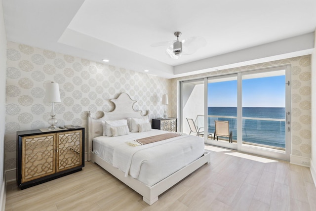 bedroom with access to outside, wood finished floors, wallpapered walls, baseboards, and ceiling fan