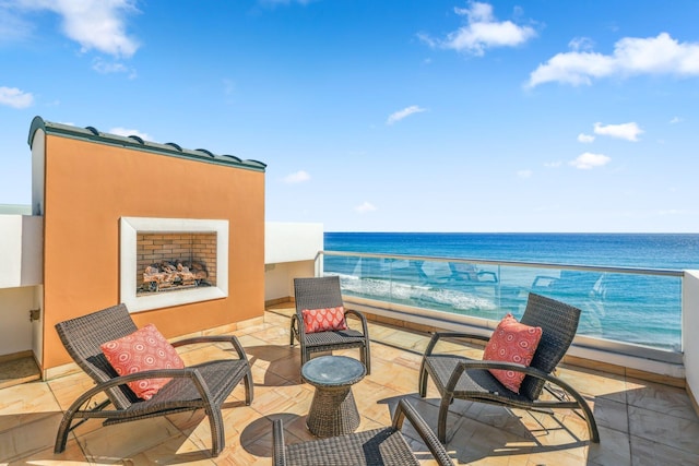 balcony with a beach view and a water view