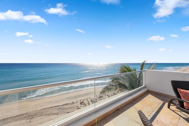 balcony with a view of the beach and a water view