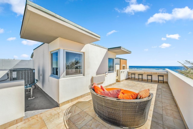 view of patio / terrace with cooling unit and a balcony