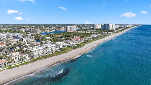 birds eye view of property with a view of city, a beach view, and a water view