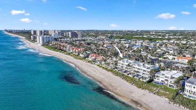 birds eye view of property featuring a city view, a beach view, and a water view